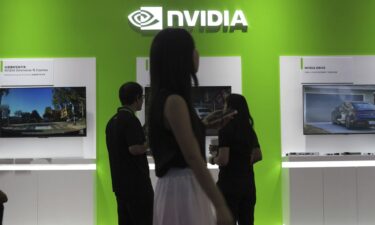 People visit the booth of Nvidia at an supply chain expo in Beijing