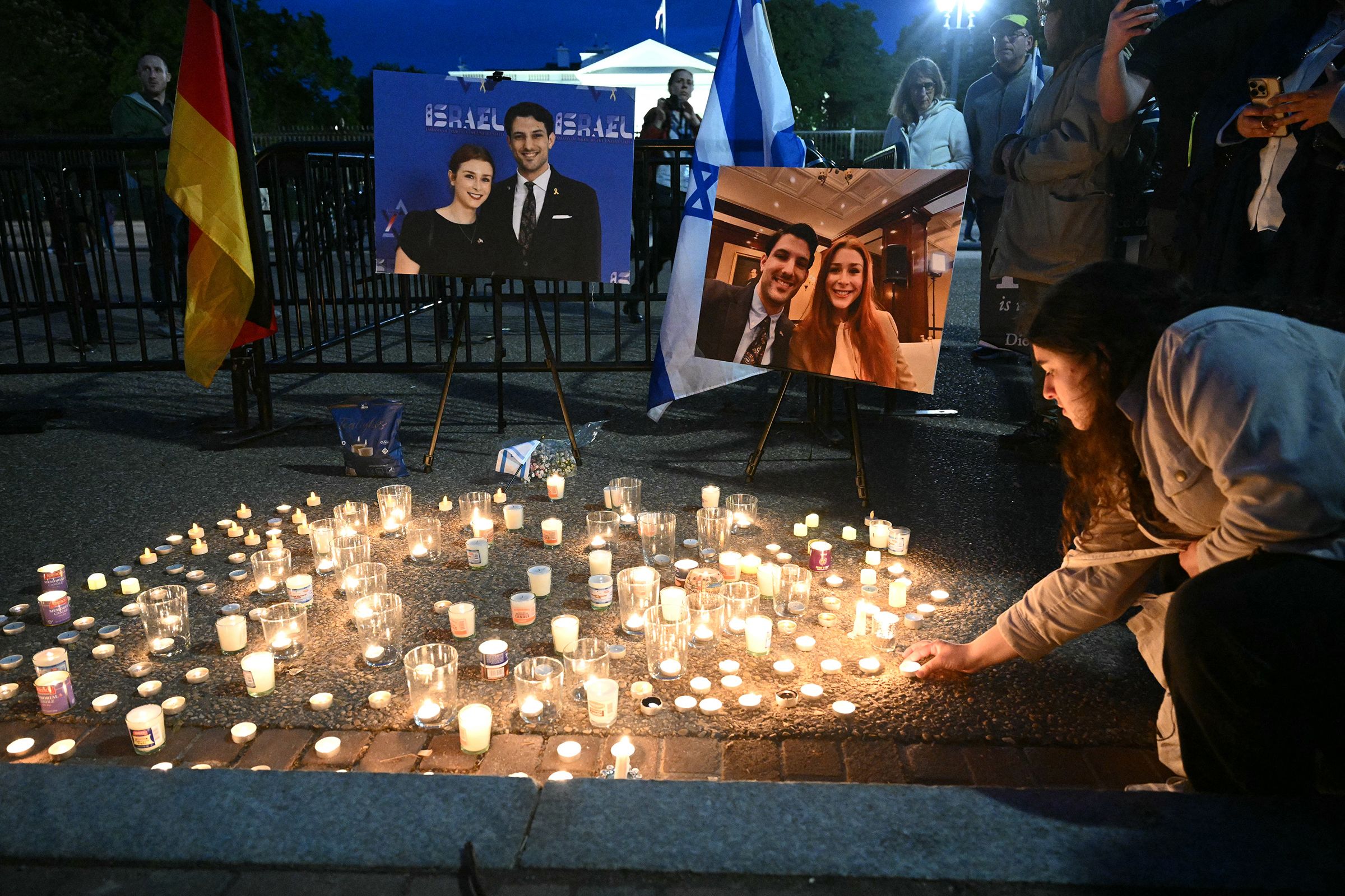 <i>Mandel Ngan/AFP/Getty Images via CNN Newsource</i><br/>People attend a candlelight vigil at Lafayette Square across from the White House in Washington
