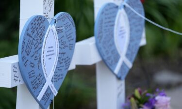 Written messages are left on hearts at a makeshift memorial at Annunciation Catholic Church and School in Minneapolis on Thursday.