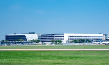 Aircraft park near terminal buildings in 2023 at Austin-Bergstrom International Airport in Texas.
