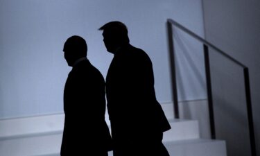 Russian President Vladimir Putin and US President Donald Trump walk together at the 2019 G20 Summit in Osaka