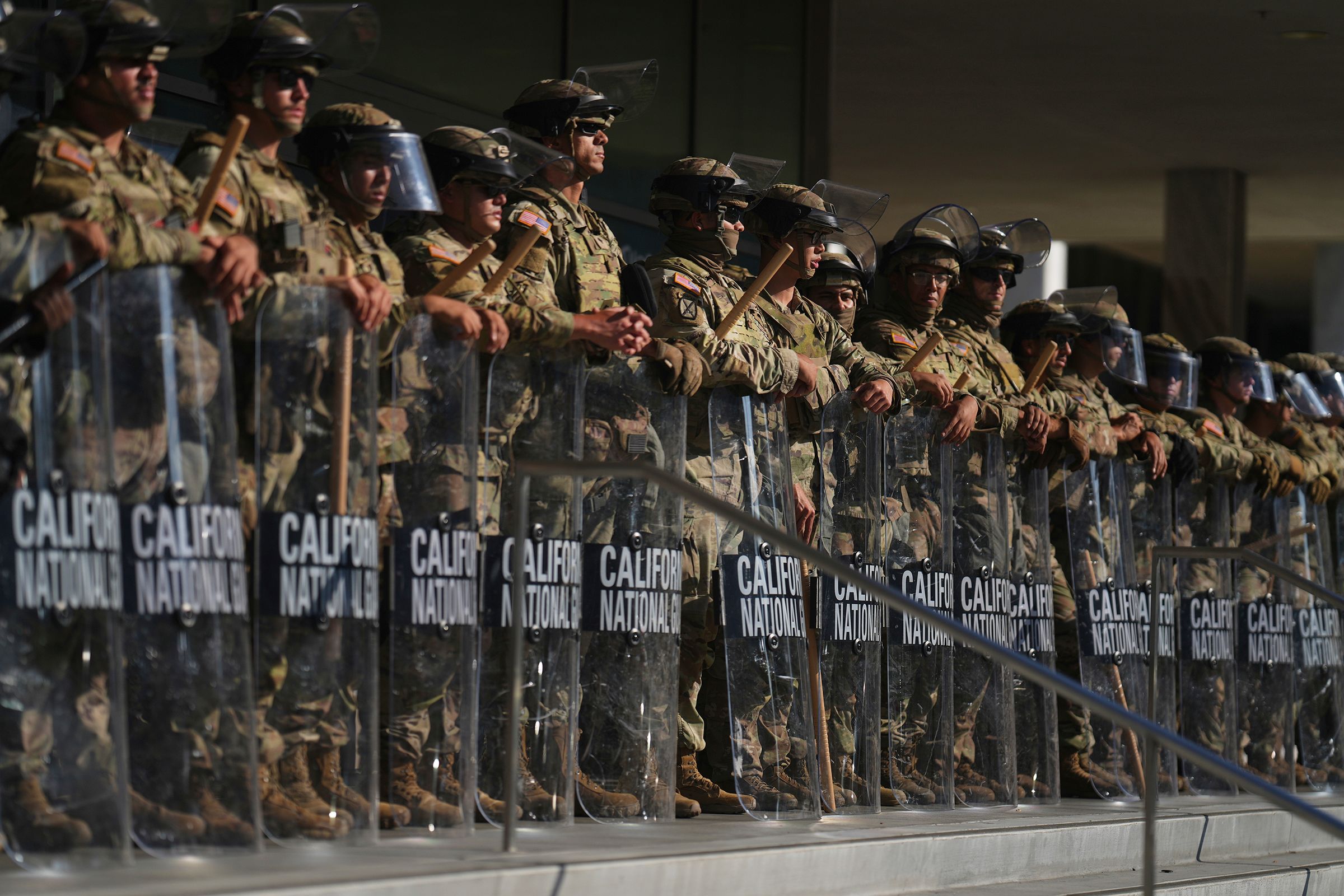 <i>Eric Thayer/AP via CNN Newsource</i><br/>California National Guard members are positioned at the Federal Building in downtown Los Angeles on June 10.