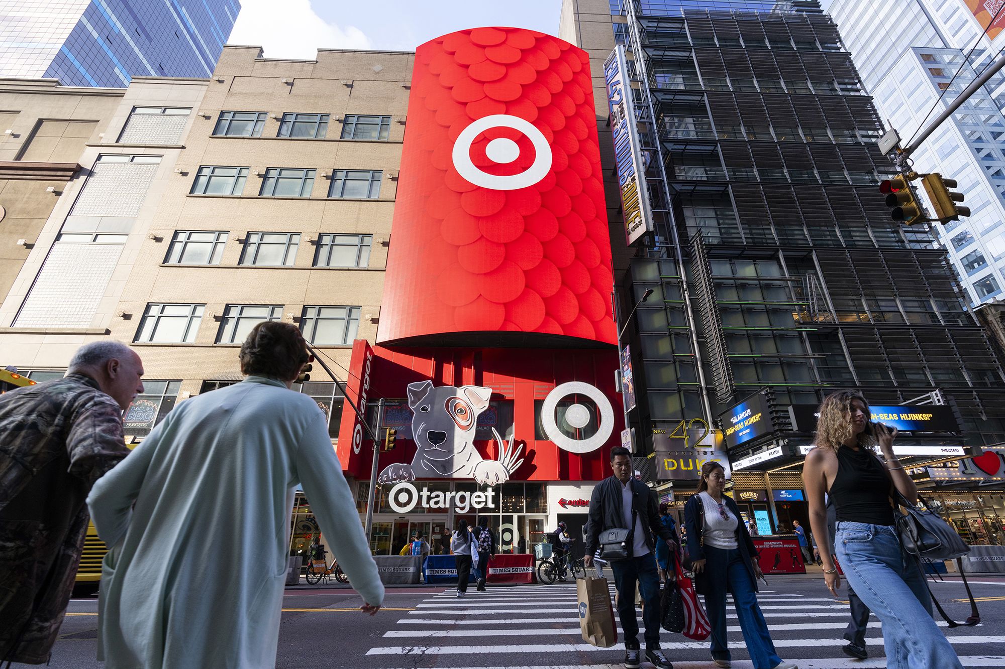 <i>Craig T Fruchtman/Getty Images via CNN Newsource</i><br/>People walk in front of the Target Store in Times Square on May 15 in New York City. Target CEO Brian Cornell is stepping down after 11 years amid struggles at one of America’s most prominent retail chains.