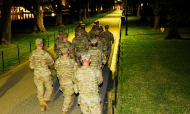 Members of the National Guard patrol the National Mall