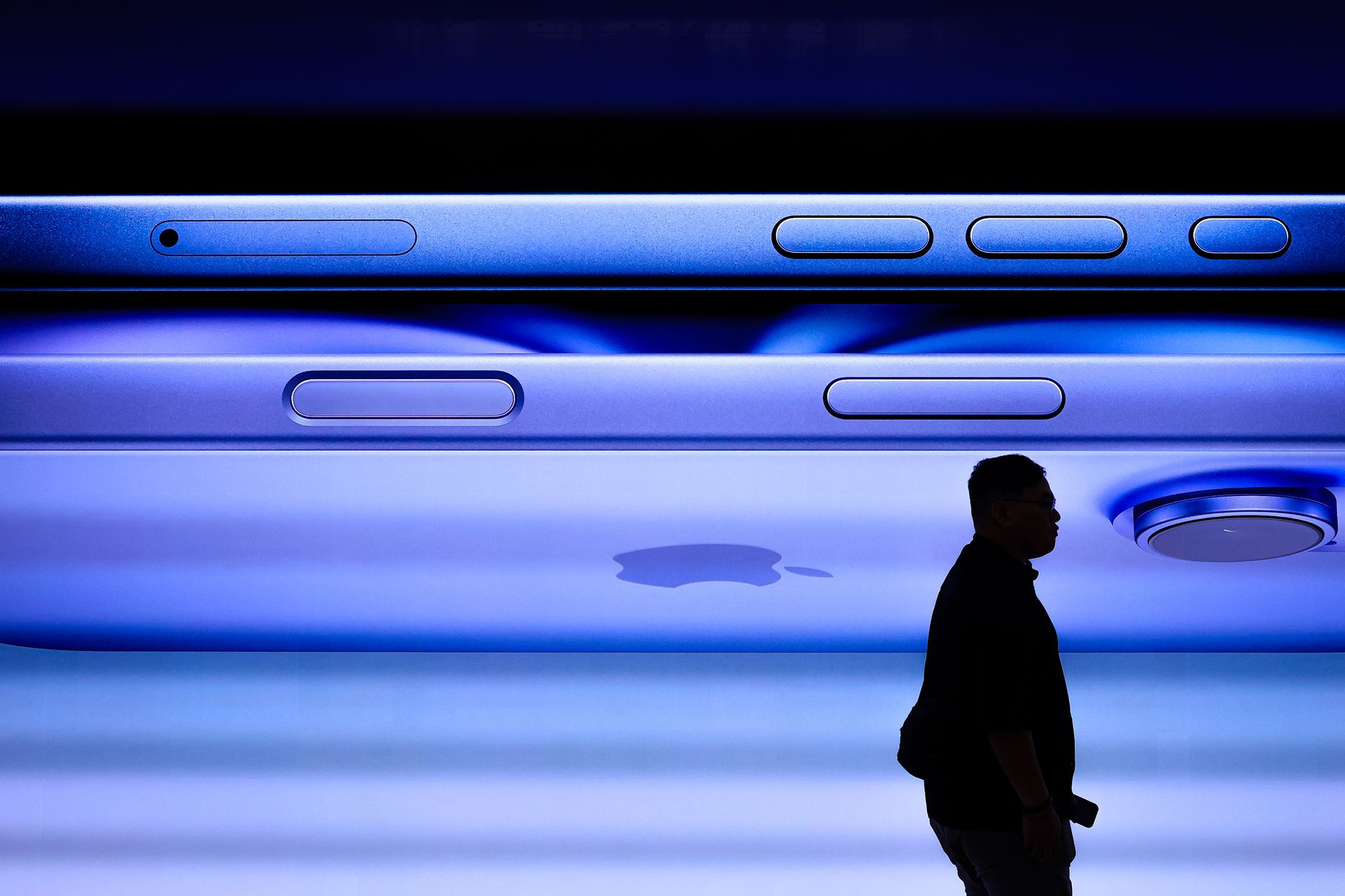 <i>Florence Lo/Reuters via CNN Newsource</i><br/>Staff members attend to customers as the new iPhone 16 series smartphones go on sale at an Apple store in Beijing