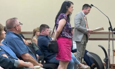 Attorney Pam Breedlove and Minden's special outside counsel Aaron Green stand before the City Council Monday.