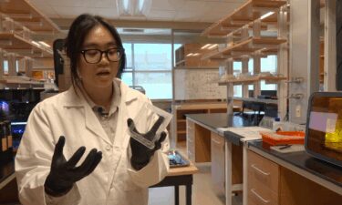 WAVR technician Emilie Luong shows off hydrogel membrane.