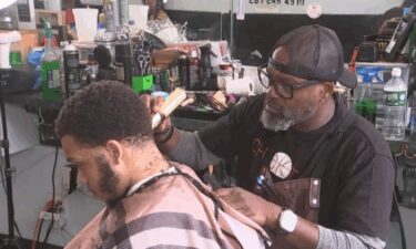Rodney Harris runs a barbershop at the intersection of 52nd and Arch streets