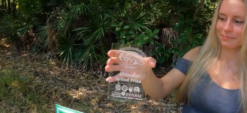<i>WBBH via CNN Newsource</i><br/>Taylor Stanberry has made history as the first woman to win the ultimate grand prize for the Florida Python Challenge