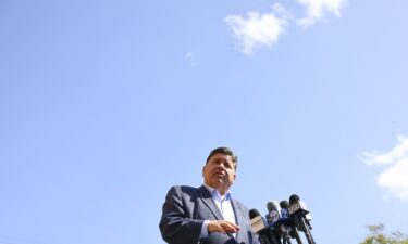 Gov. JB Pritzker speaks with reporters in Berwyn