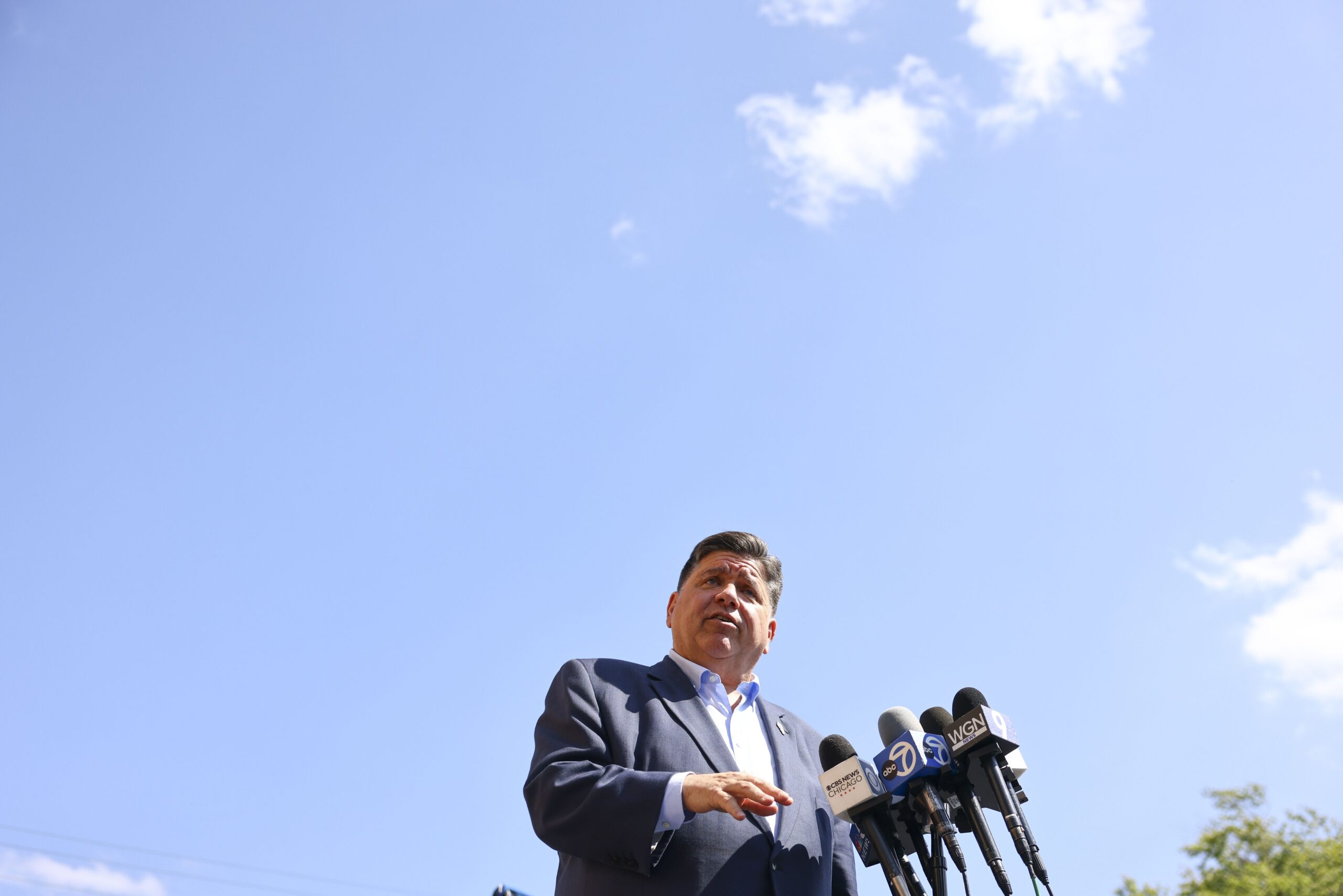 <i>Anthony Vazquez/AP via CNN Newsource</i><br/>Gov. JB Pritzker speaks with reporters in Berwyn