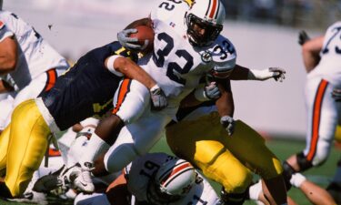 Auburn's Rudi Johnson runs with the ball against Michigan in 2001.