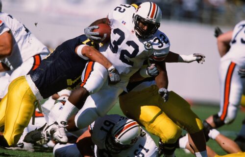 Auburn's Rudi Johnson runs with the ball against Michigan in 2001.