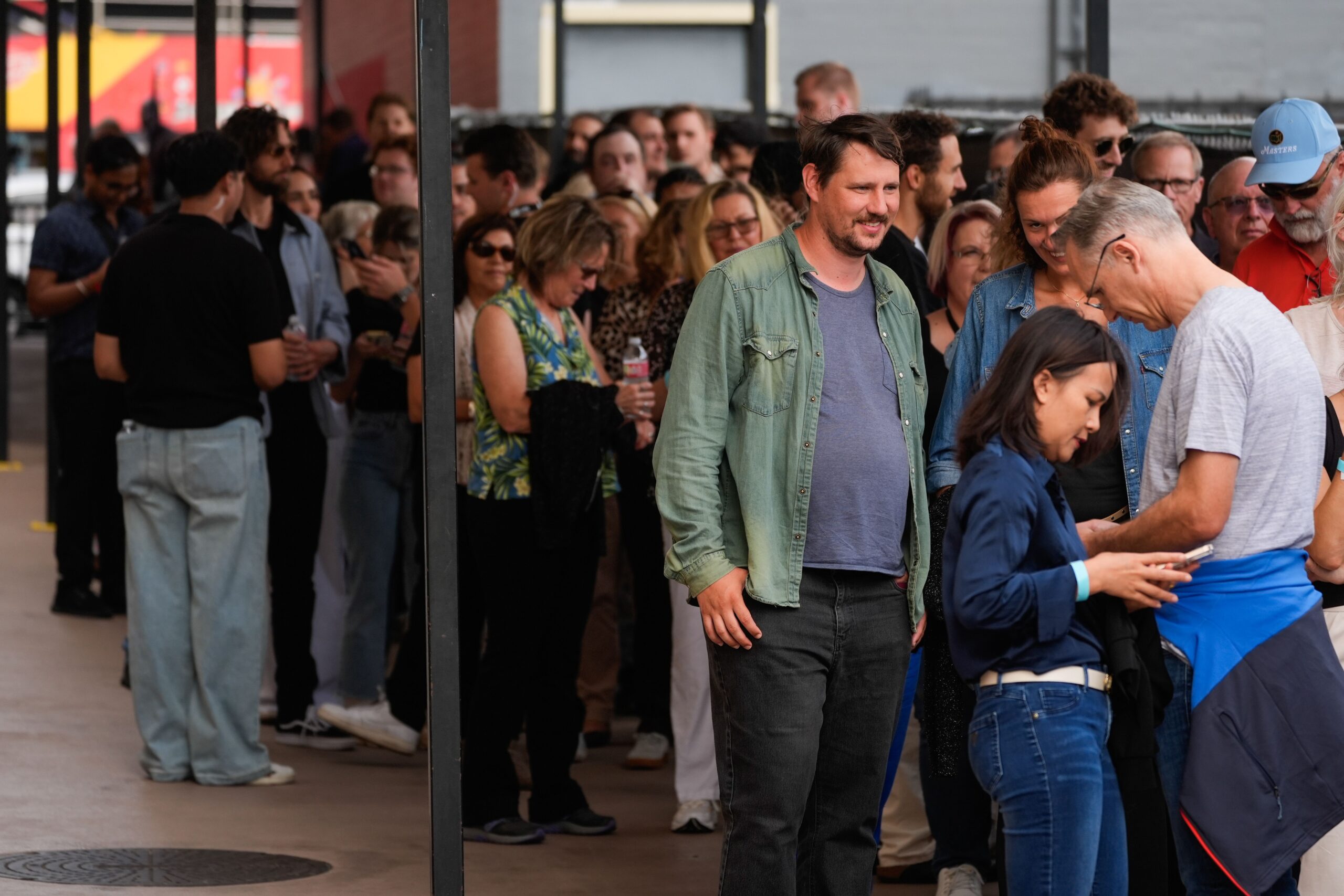 <i>Chris Pizzello/Invision/AP via CNN Newsource</i><br/>Audience members wait in line to enter the Jimmy Kimmel Live studio in Los Angeles