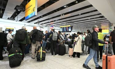 Travelers wait in the terminal at Heathrow Airport after European airports including Brussels