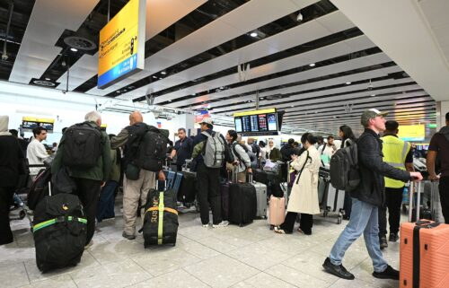 Travelers wait in the terminal at Heathrow Airport after European airports including Brussels