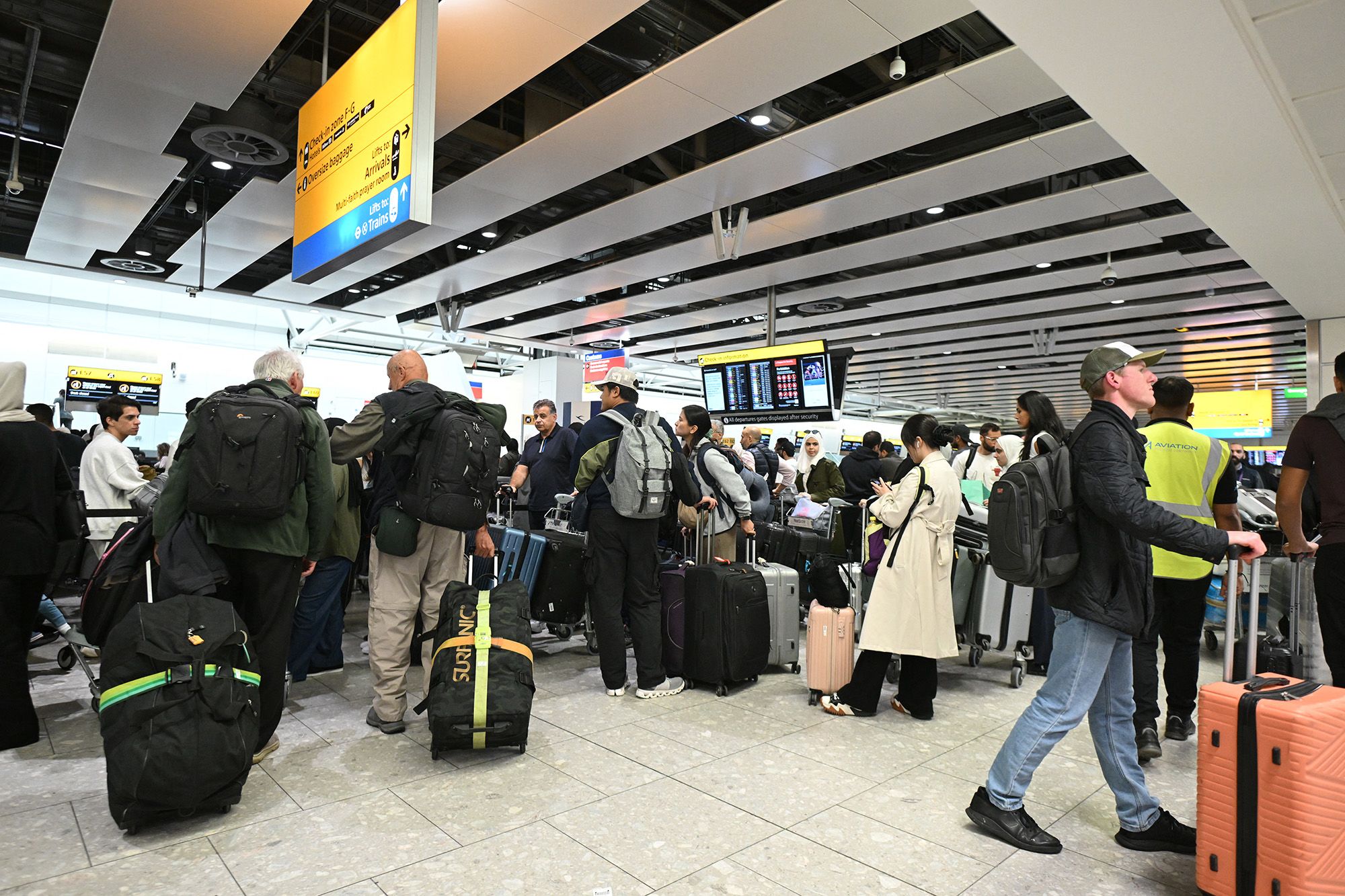 <i>Justin Tallis/AFP/Getty Images via CNN Newsource</i><br/>Travelers wait in the terminal at Heathrow Airport after European airports including Brussels