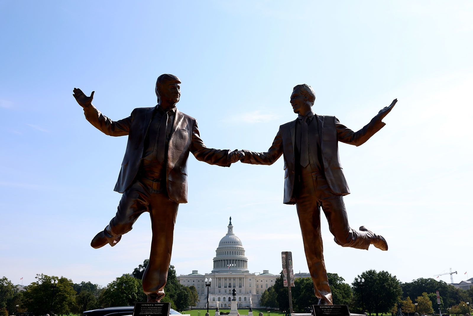 A statue of a golden TV  is placed on the National Mall in Washington