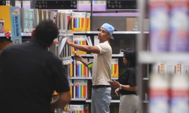 Shoppers look at school supplies at a Walmart in Dallas on August 12.