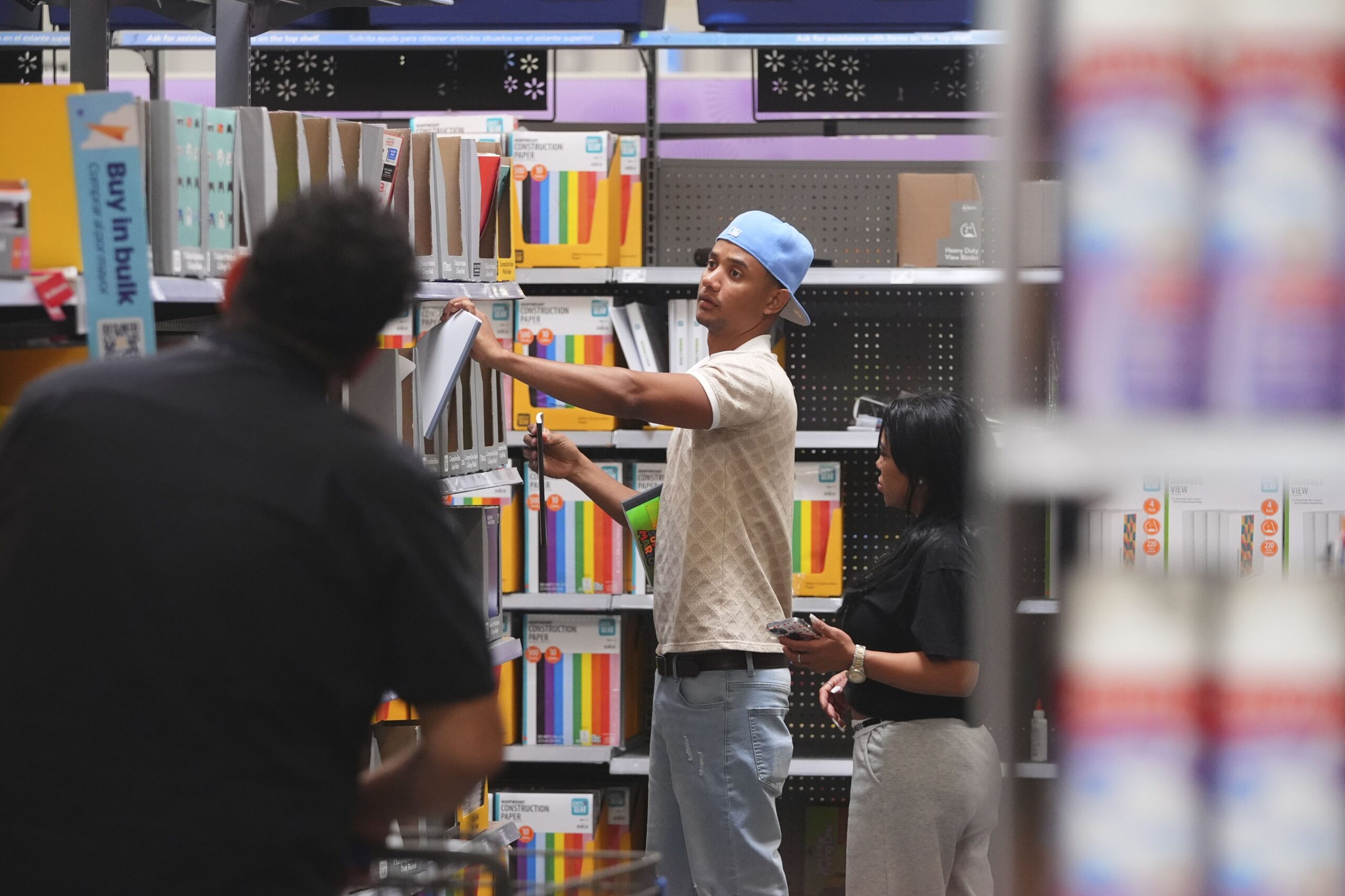 <i>LM Otero/AP via CNN Newsource</i><br/>Shoppers look at school supplies at a Walmart in Dallas on August 12.