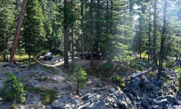 This photo provided by FBI Seattle shows several law enforcement agencies participating in the search for Travis Decker.