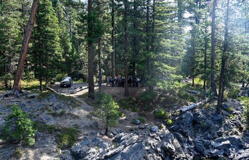 This photo provided by FBI Seattle shows several law enforcement agencies participating in the search for Travis Decker.