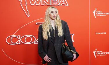 Paige Bueckers wears a shimmering Coach pantsuit on the orange carpet during the 2025 WNBA Draft on April 14.