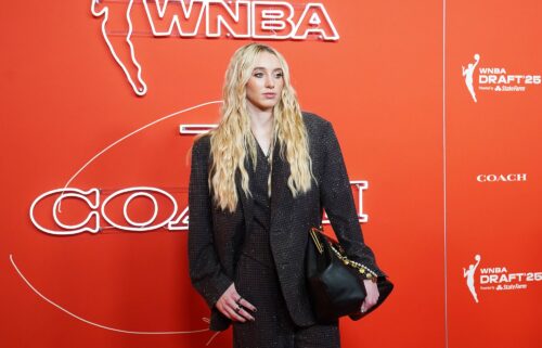 Paige Bueckers wears a shimmering Coach pantsuit on the orange carpet during the 2025 WNBA Draft on April 14.