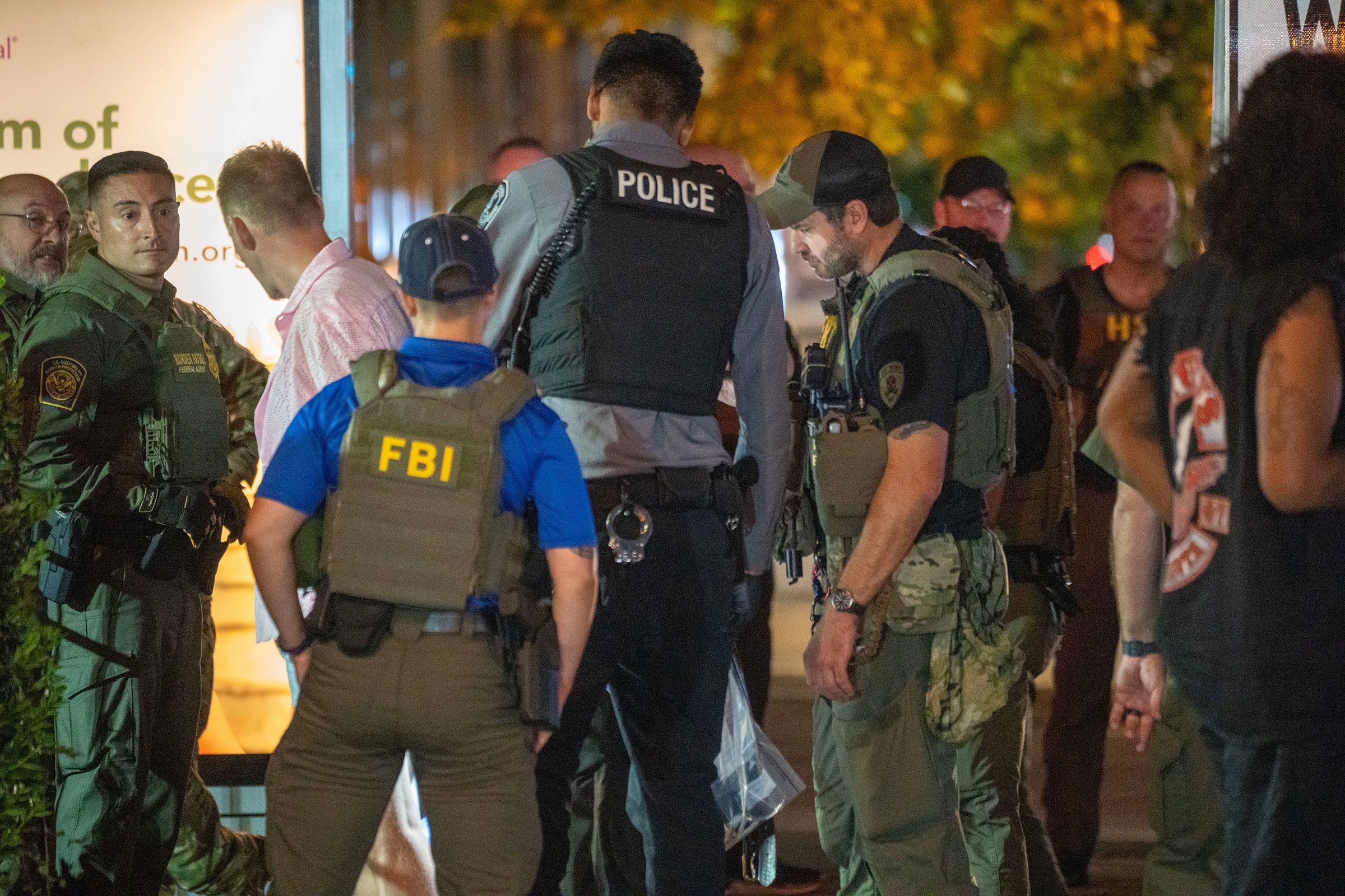 <i>Andrew Leyden/Getty Images via CNN Newsource</i><br/>FBI and Border Patrol officers arrest a man