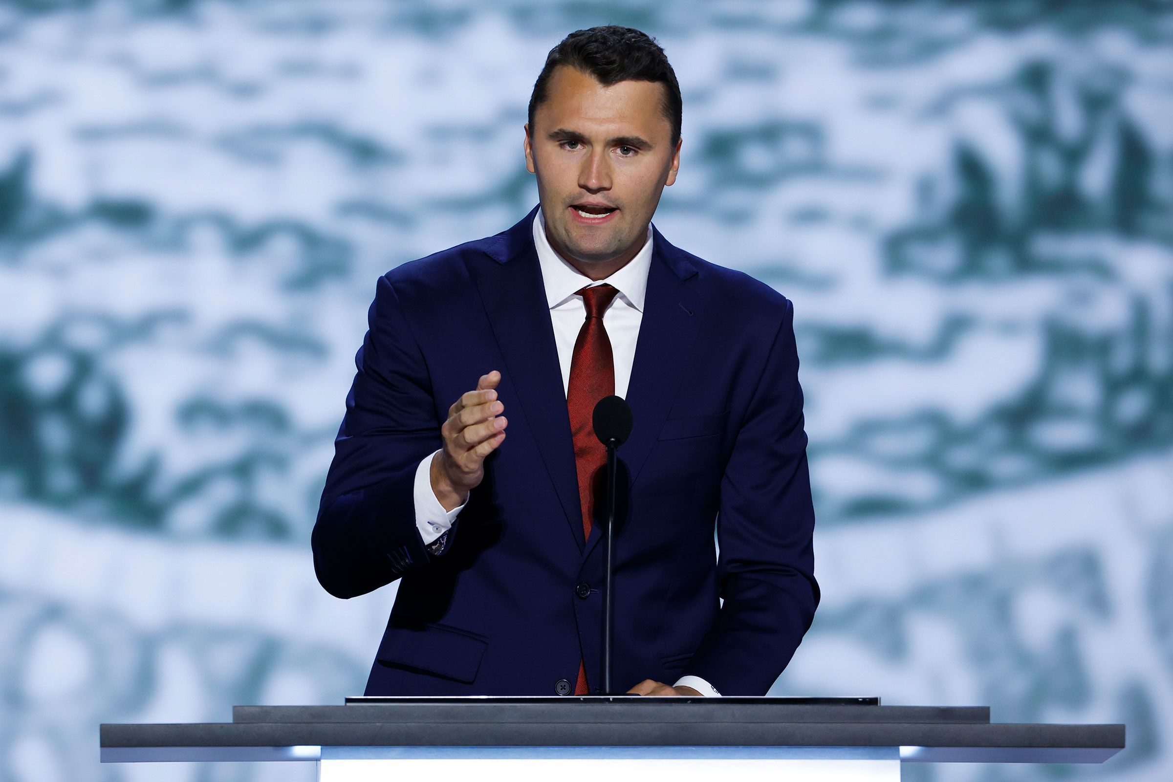 CEO of Turning Point USA Charlie Kirk speaks on stage during the first day of the Republican National Convention in Milwaukee
