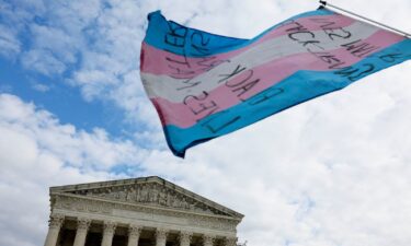 A transgender flag waves outside the US Supreme Court in Washington