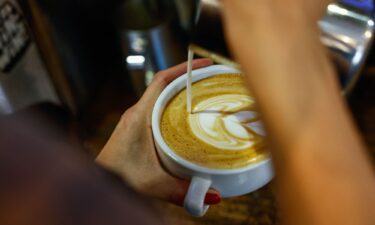 A worker prepares a coffee in New York.