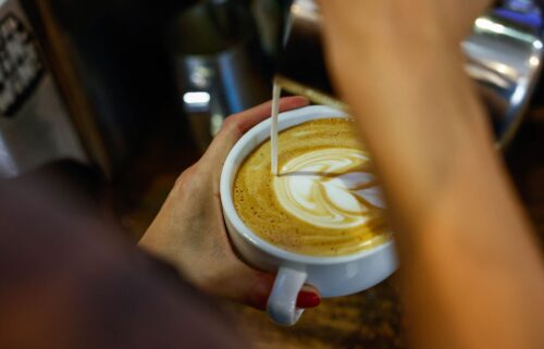 A worker prepares a coffee in New York.