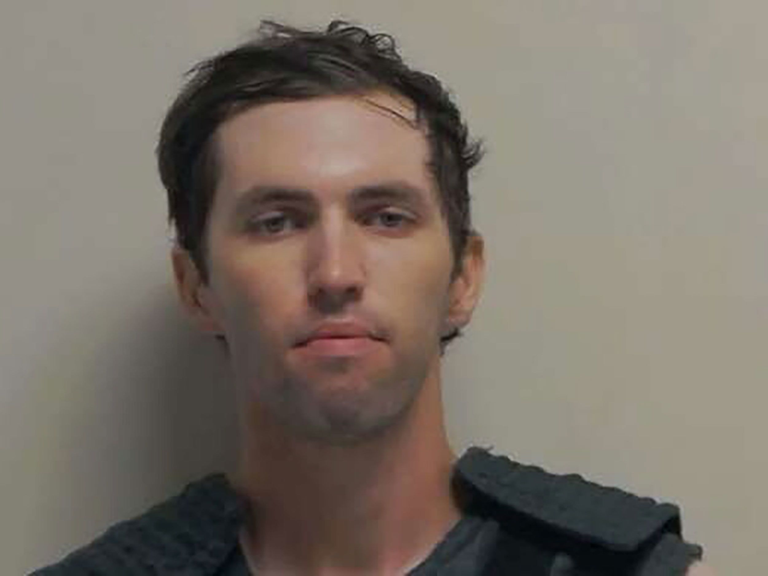 A mugshot released by the Utah Governor's Office shows Charlie Kirk shooting suspect Tyler Robinson.