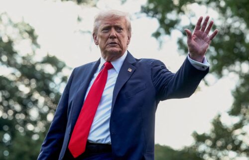 President Donald Trump waves to the media before boarding Marine One in Washington