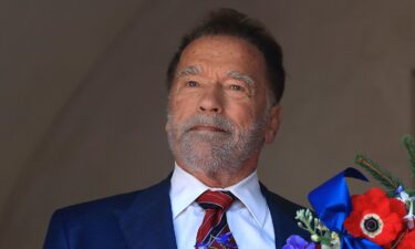 Former California Gov. Arnold Schwarzenegger lays a wreath at George Washington's tomb during An American Celebration 2025 in Mount Vernon