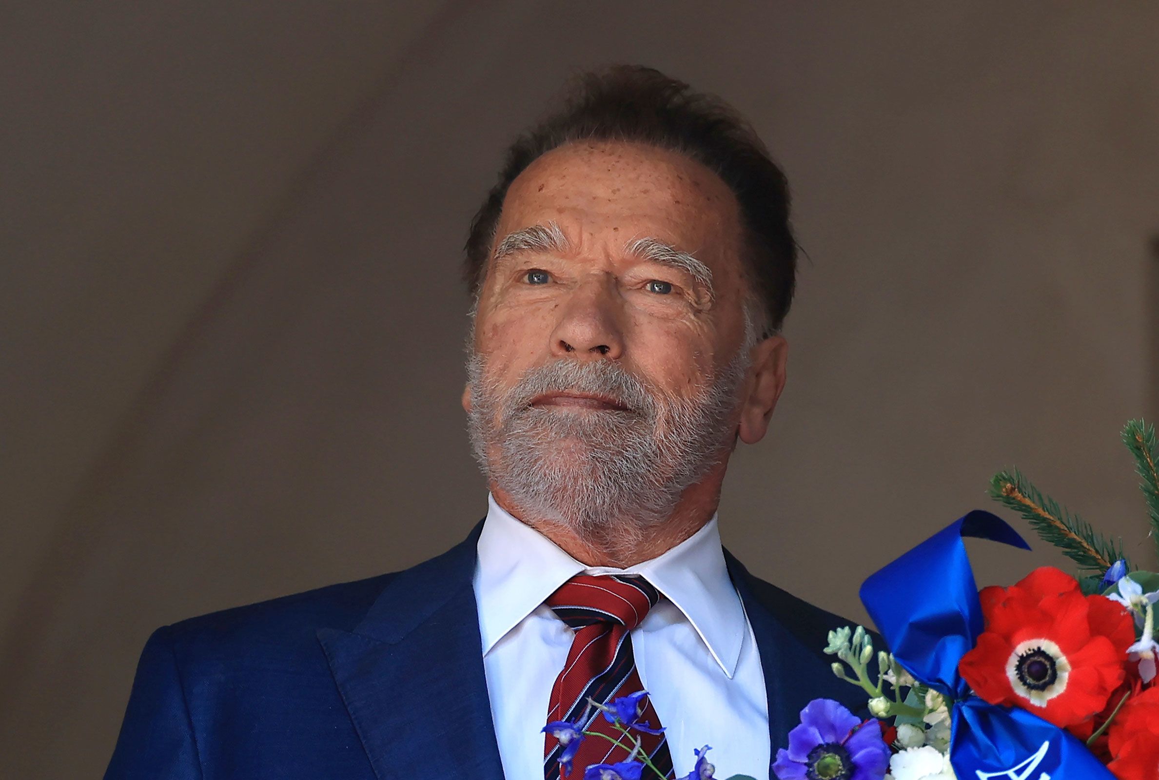 Former California Gov. Arnold Schwarzenegger lays a wreath at George Washington's tomb during An American Celebration 2025 in Mount Vernon