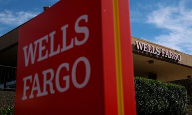 A sign is posted in front of a Wells Fargo bank office in San Rafael