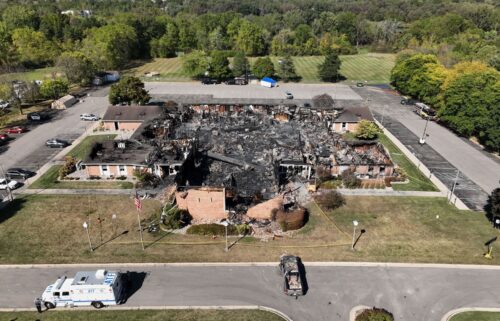 Church members and residents reunite at the Trillium Theater located across the street from the site of the shooting and fire at the Church of Jesus Christ of Latter-day Saints in Grand Blanc