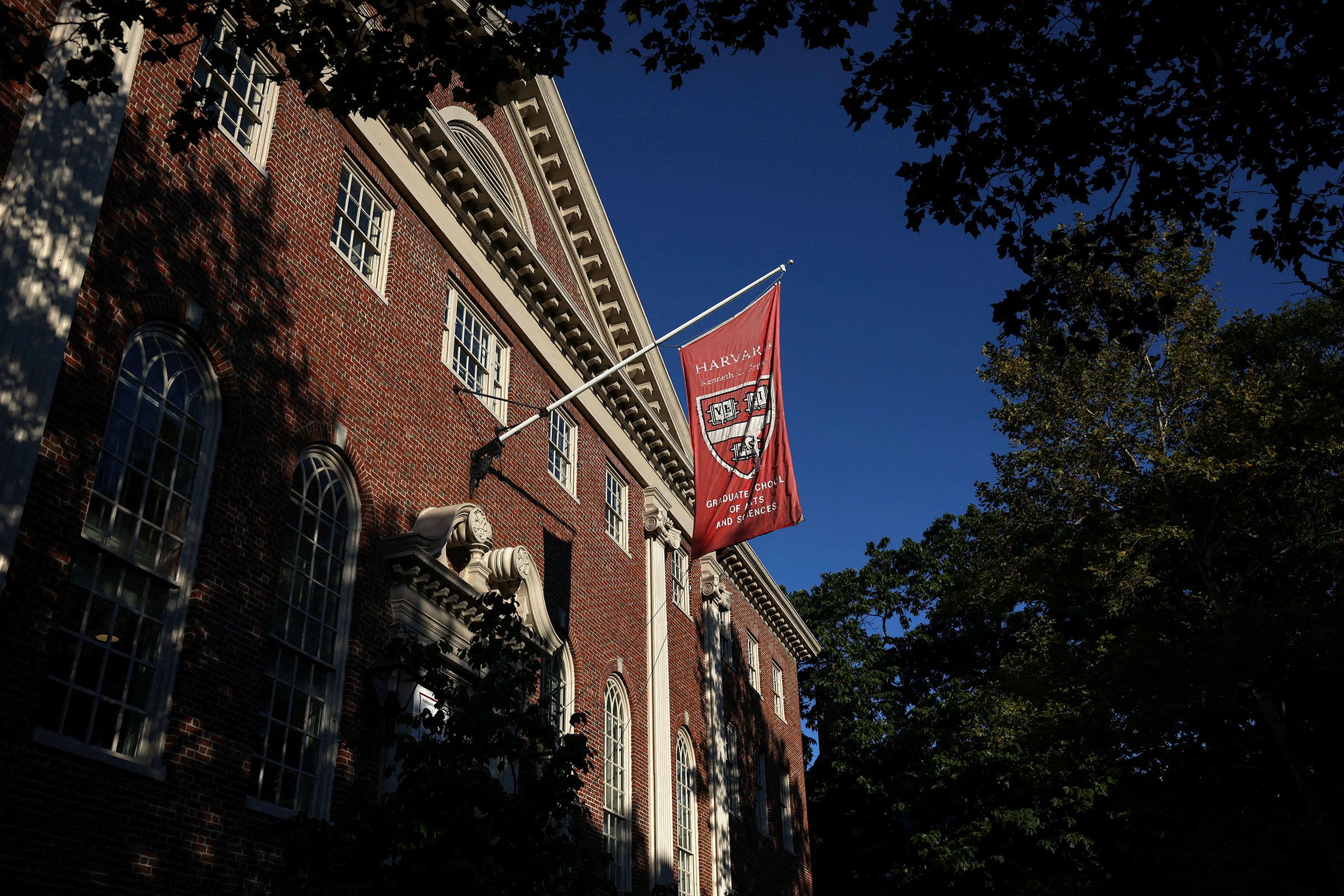 <i>Shannon Stapleton/Reuters/File via CNN Newsource</i><br/>A flag hangs on campus at Harvard University in Cambridge