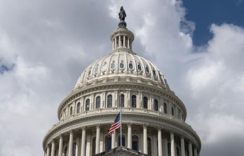 The US flag flies at half-mast on the US Capitol in Washington