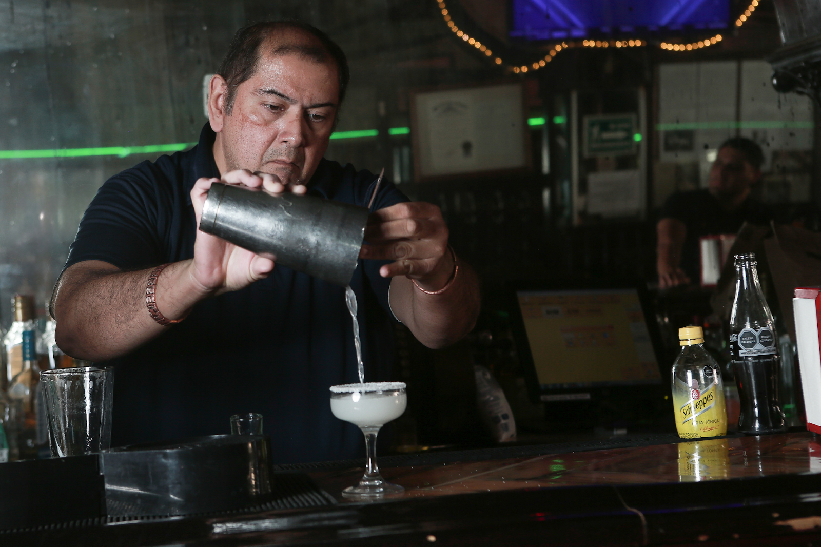 Bartender Teodoro Morales mixes the Kentucky Club's famous margarita. The bar in Ciudad Juárez claims to be the birthplace of that cocktail.