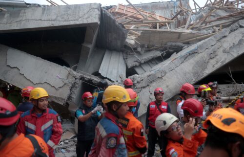 Rescuers search for survivors in the rubble on September 30