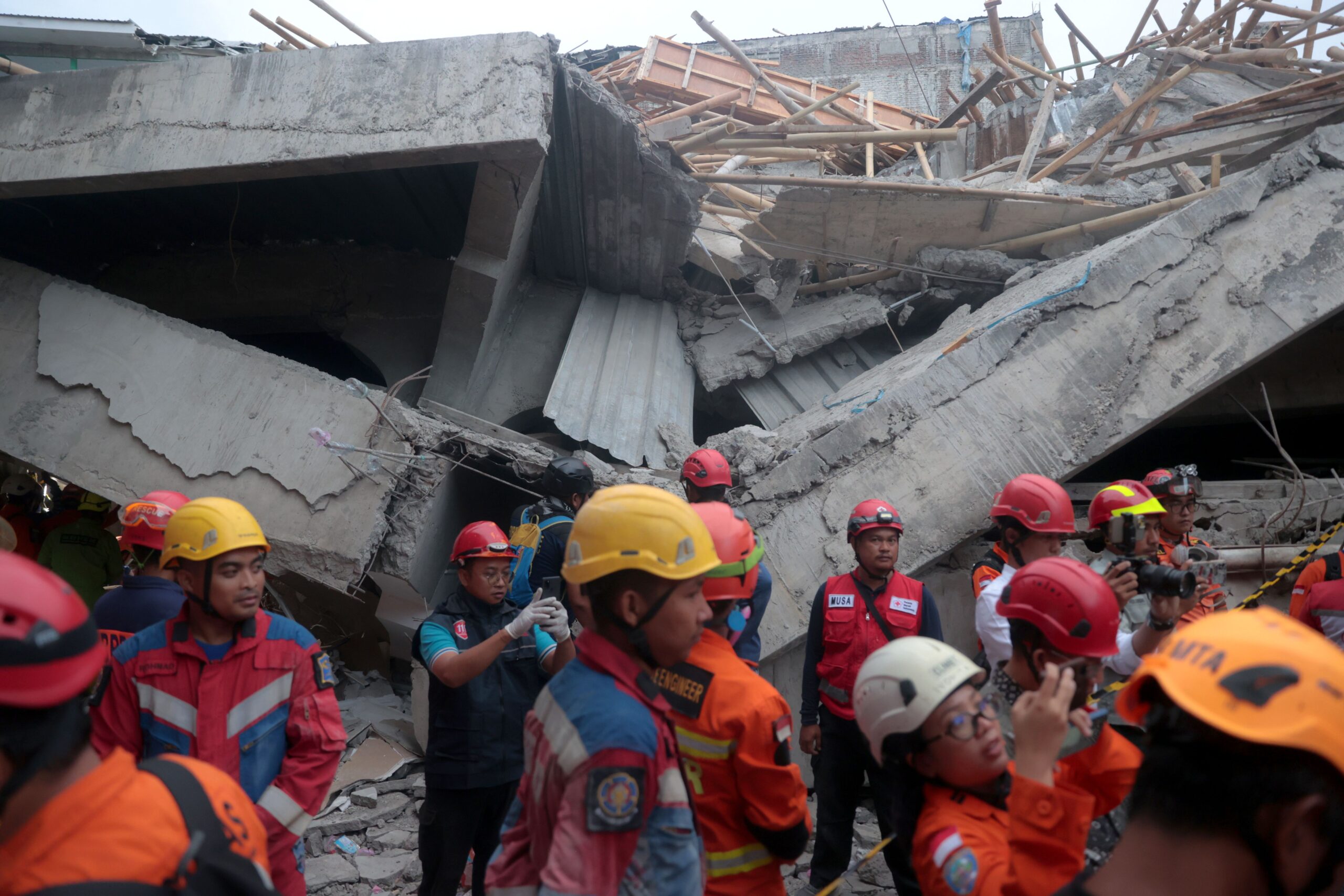 Rescuers search for survivors in the rubble on September 30