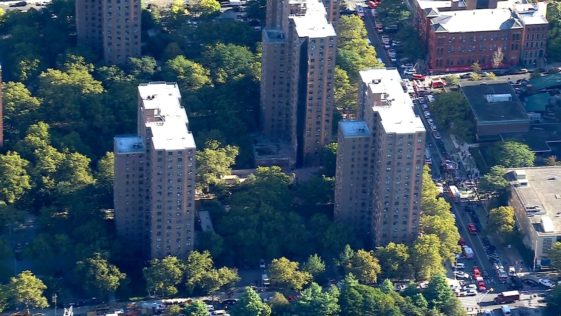 Firefighters work near the site of a partial building collapse in the Bronx borough of New York City on October 1.