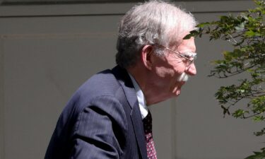Former White House national security adviser John Bolton arrives at his house in Bethesda