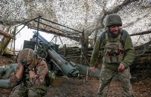 Ukrainian soldiers fire an M114 self-propelled howitzer towards Russian troops near the frontline town of Pokrovsk in Donetsk region