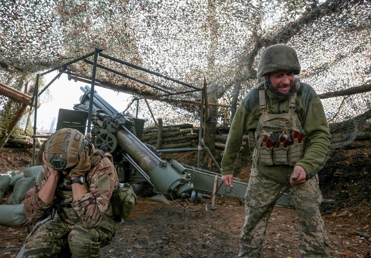 <i>Anatolii Stepanov/Reuters via CNN Newsource</i><br/>Ukrainian soldiers fire an M114 self-propelled howitzer towards Russian troops near the frontline town of Pokrovsk in Donetsk region