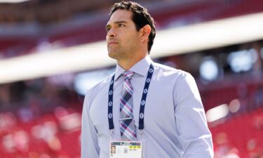 NFL analyst Mark Sanchez stands on the field prior to an NFL football game on September 21