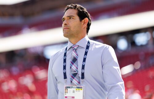 NFL analyst Mark Sanchez stands on the field prior to an NFL football game on September 21